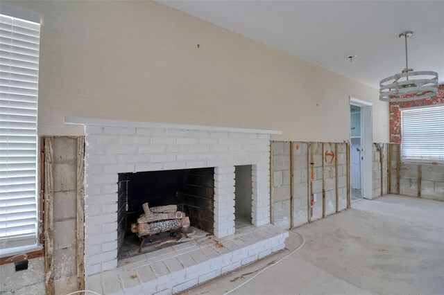 1897 Dolphin Blvd S, Saint Petersburg, FL 33707 - detailed view of concrete floors and a brick fireplace