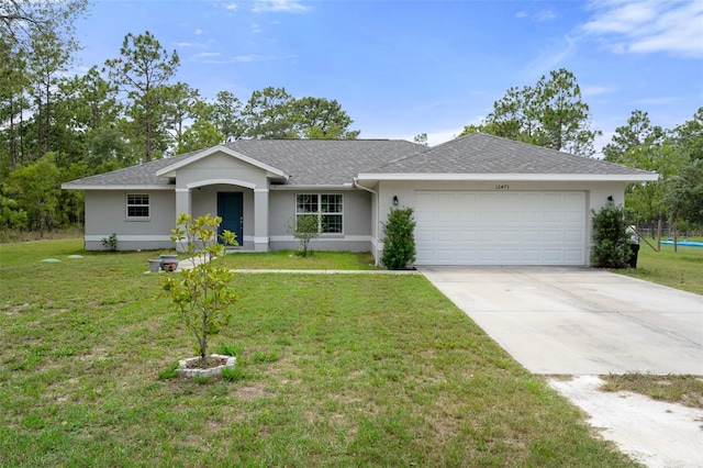 16473 Scaup Duck Ave, Weeki Wachee, FL 34614 - ranch-style house with an attached garage, stucco siding, concrete driveway, and a front yard