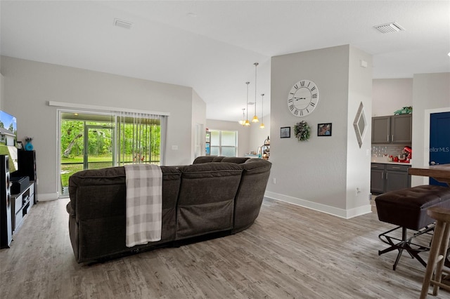 16473 Scaup Duck Ave, Weeki Wachee, FL 34614 - living room with light wood-style flooring and baseboards