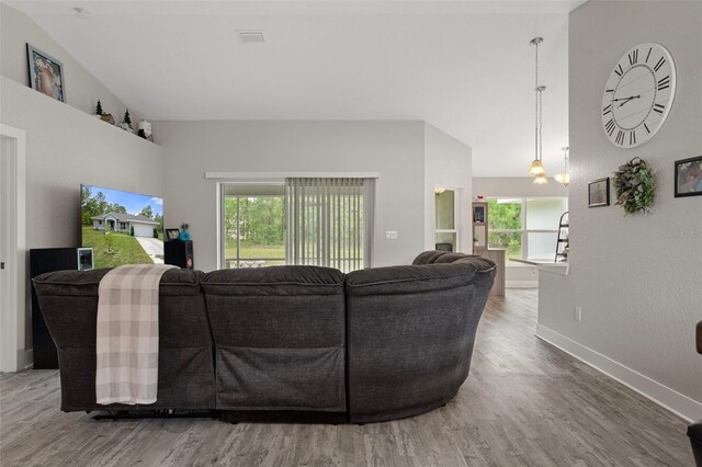 16473 Scaup Duck Ave, Weeki Wachee, FL 34614 - living room featuring wood finished floors and baseboards