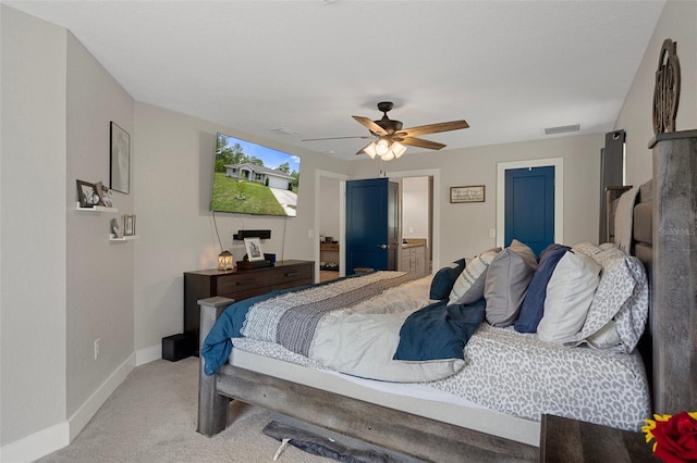 16473 Scaup Duck Ave, Weeki Wachee, FL 34614 - bedroom featuring light carpet, baseboards, and ceiling fan