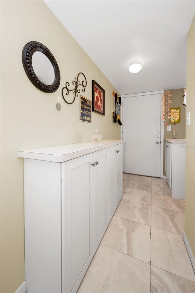 960 Virginia St Unit 202, Dunedin, FL 34698 - hall featuring light marble finish flooring