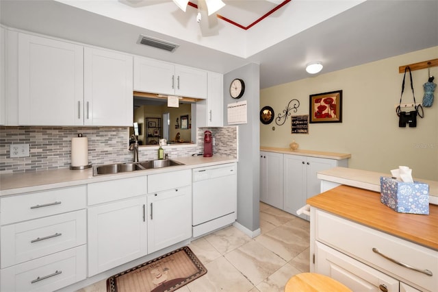 960 Virginia St Unit 202, Dunedin, FL 34698 - kitchen featuring white dishwasher, backsplash, and light countertops