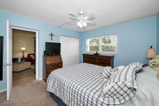 960 Virginia St Unit 202, Dunedin, FL 34698 - bedroom with a closet, carpet flooring, a textured ceiling, and ceiling fan