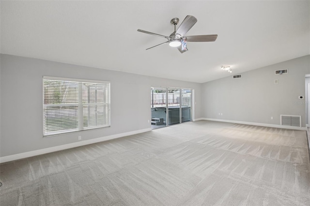 3121 Egret Ter, Safety Harbor, FL 34695 - spare room with lofted ceiling, a ceiling fan, carpet floors, and baseboards