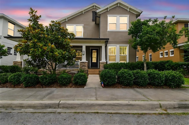 10422 Fenceline Rd, New Port Richey, FL 34655 - view of front of property featuring a porch and stucco siding