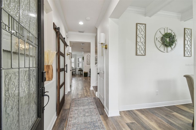 10422 Fenceline Rd, New Port Richey, FL 34655 - entryway featuring a barn door, dark wood-style flooring, crown molding, recessed lighting, and baseboards