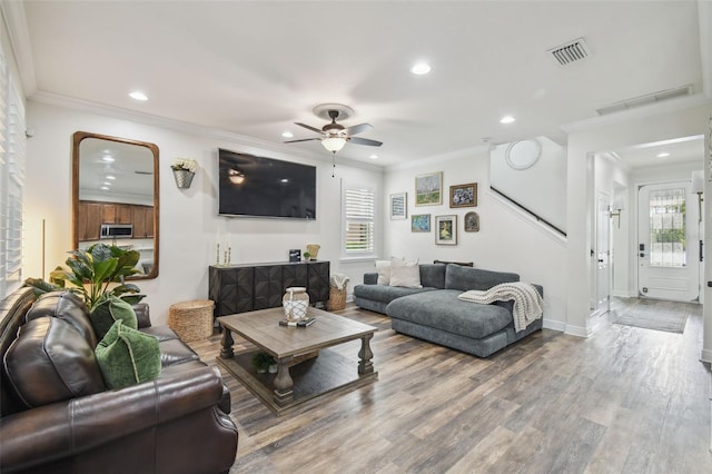 10422 Fenceline Rd, New Port Richey, FL 34655 - living area with recessed lighting, ceiling fan, plenty of natural light, crown molding, and wood finished floors