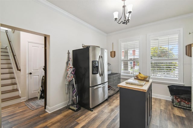 10422 Fenceline Rd, New Port Richey, FL 34655 - kitchen with stainless steel fridge with ice dispenser, wooden counters, ornamental molding, dark wood finished floors, and a chandelier