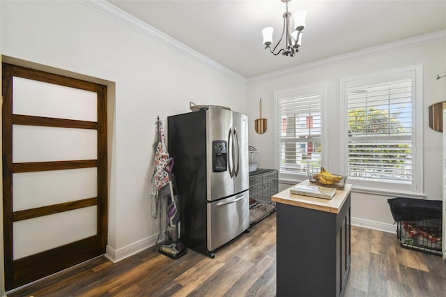 10422 Fenceline Rd, New Port Richey, FL 34655 - kitchen with stainless steel refrigerator with ice dispenser, butcher block countertops, crown molding, dark wood-style floors, and a chandelier
