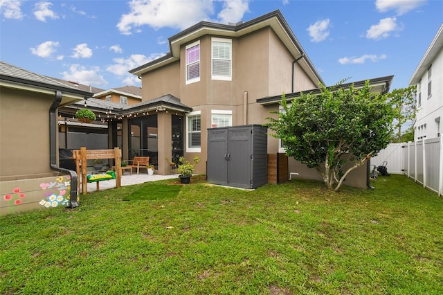 10422 Fenceline Rd, New Port Richey, FL 34655 - rear view of house featuring stucco siding and a patio area