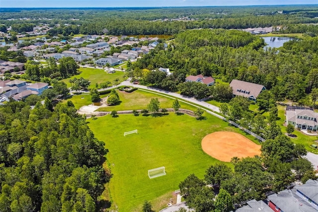 10422 Fenceline Rd, New Port Richey, FL 34655 - aerial perspective of suburban area featuring a large body of water and a heavily wooded area