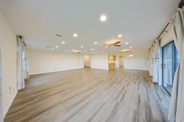 1508 Ingram Dr Unit 20, Sun City Center, FL 33573 - unfurnished living room with recessed lighting, ceiling fan, light wood-style flooring, and baseboards