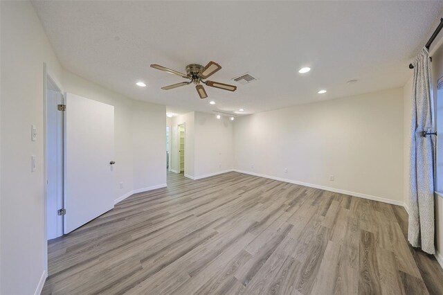 1508 Ingram Dr Unit 20, Sun City Center, FL 33573 - spare room with light wood finished floors, ceiling fan, recessed lighting, and baseboards