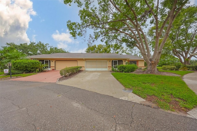 1508 Ingram Dr Unit 20, Sun City Center, FL 33573 - single story home featuring an attached garage, driveway, stucco siding, and a front lawn