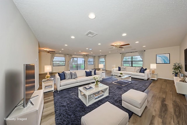 1508 Ingram Dr Unit 20, Sun City Center, FL 33573 - living area featuring ceiling fan, wood finished floors, recessed lighting, baseboards, and a textured ceiling