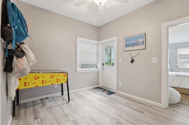 1525 38th Ave N, Saint Petersburg, FL 33704 - foyer entrance featuring wood finished floors, ceiling fan, and baseboards