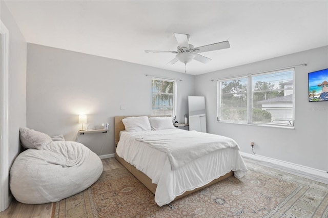 1525 38th Ave N, Saint Petersburg, FL 33704 - bedroom featuring baseboards, wood finished floors, and ceiling fan