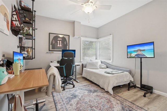 1525 38th Ave N, Saint Petersburg, FL 33704 - bedroom featuring wood finished floors, a desk, ceiling fan, and baseboards