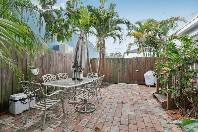 1525 38th Ave N, Saint Petersburg, FL 33704 - fenced backyard featuring a patio area and outdoor dining space
