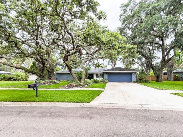 3005 Wilton Ln, Valrico, FL 33596 - ranch-style home featuring a garage and driveway