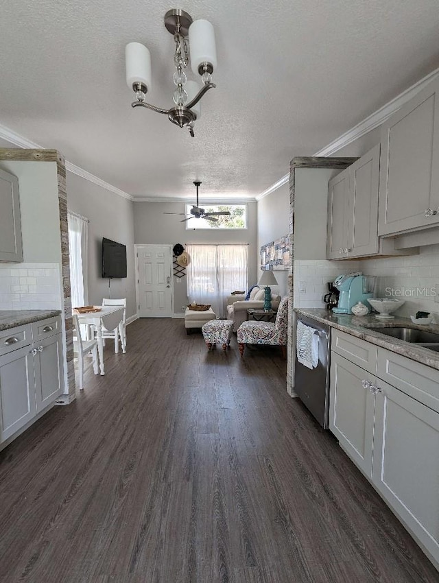 85 Heather Point Ct Unit 850, New Smyrna Beach, FL 32169 - kitchen featuring dishwasher, crown molding, decorative backsplash, dark wood-style floors, and a ceiling fan