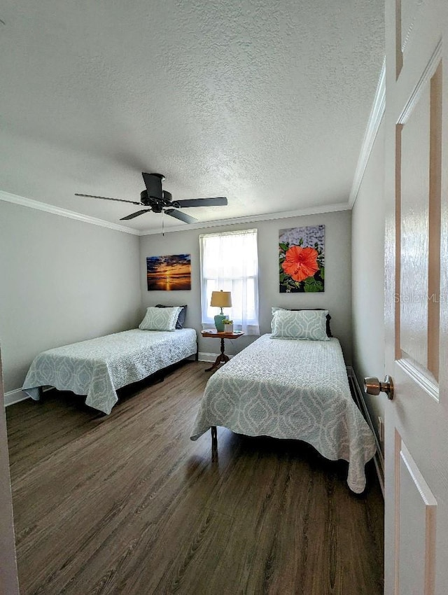 85 Heather Point Ct Unit 850, New Smyrna Beach, FL 32169 - bedroom featuring wood finished floors, crown molding, baseboards, ceiling fan, and a textured ceiling