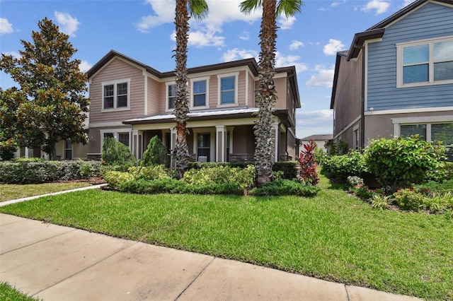 14110 Barrington Stowers Dr, Lithia, FL 33547 - traditional home with a front lawn, stucco siding, and a porch