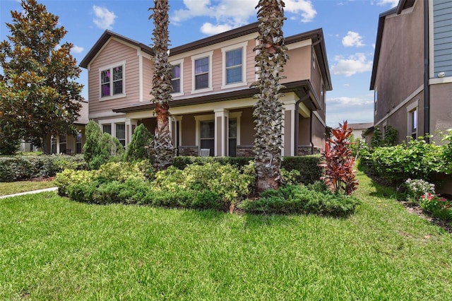 14110 Barrington Stowers Dr, Lithia, FL 33547 - view of front of property with a front lawn and covered porch