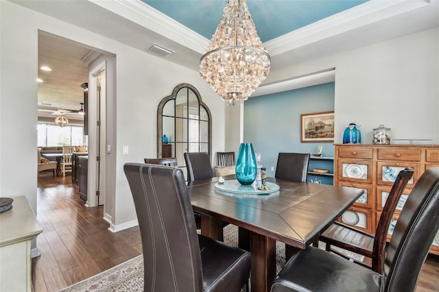 14110 Barrington Stowers Dr, Lithia, FL 33547 - dining room featuring a chandelier, dark wood-style flooring, crown molding, recessed lighting, and baseboards
