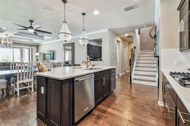 14110 Barrington Stowers Dr, Lithia, FL 33547 - kitchen with stainless steel appliances, a chandelier, a sink, ceiling fan, and crown molding