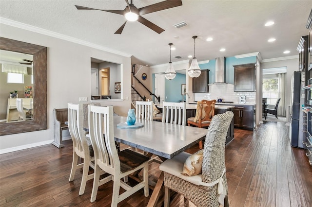 14110 Barrington Stowers Dr, Lithia, FL 33547 - dining room with a ceiling fan, dark wood finished floors, stairs, crown molding, and recessed lighting