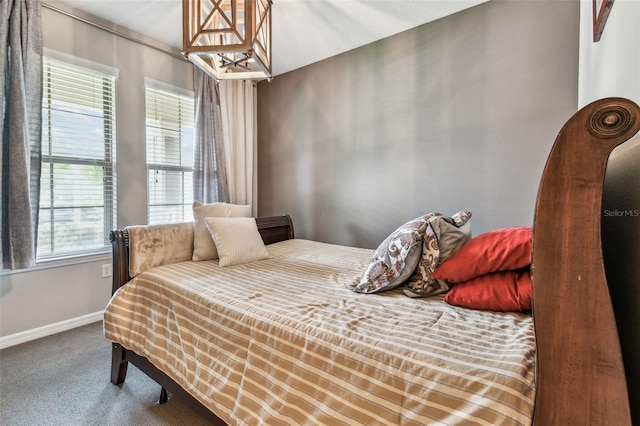 14110 Barrington Stowers Dr, Lithia, FL 33547 - bedroom featuring a chandelier, carpet flooring, and baseboards