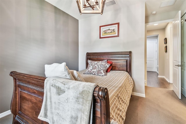 14110 Barrington Stowers Dr, Lithia, FL 33547 - carpeted bedroom with baseboards and a chandelier