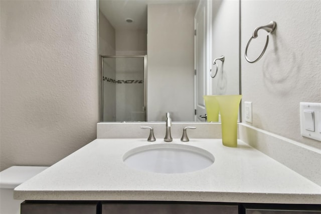 14110 Barrington Stowers Dr, Lithia, FL 33547 - full bath featuring vanity, a stall shower, and a textured wall