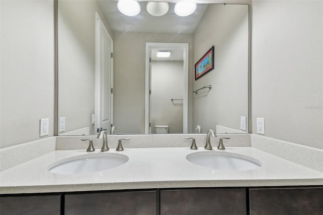 14110 Barrington Stowers Dr, Lithia, FL 33547 - bathroom featuring double vanity and toilet