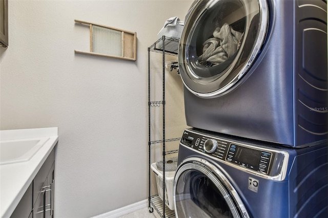 14110 Barrington Stowers Dr, Lithia, FL 33547 - washroom with stacked washing machine and dryer and baseboards