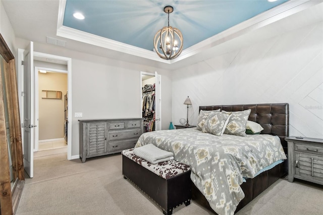 14110 Barrington Stowers Dr, Lithia, FL 33547 - carpeted bedroom with a chandelier, a raised ceiling, a walk in closet, ornamental molding, and a closet