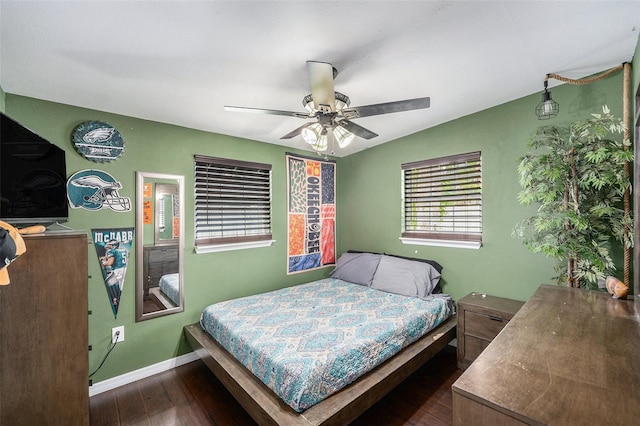 8556 91st Ter, Seminole, FL 33777 - bedroom featuring dark wood-style flooring, baseboards, and a ceiling fan