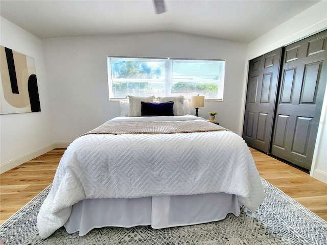 1373 Fairfax Rd, Clearwater, FL 33764 - bedroom featuring light wood finished floors and vaulted ceiling