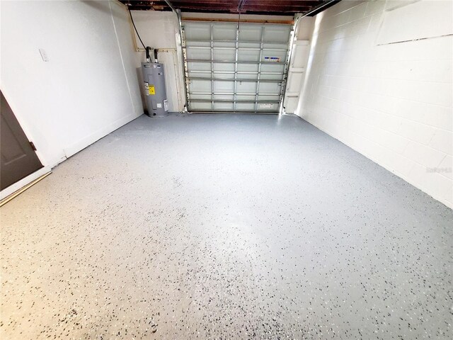 1373 Fairfax Rd, Clearwater, FL 33764 - garage with electric water heater and concrete block wall