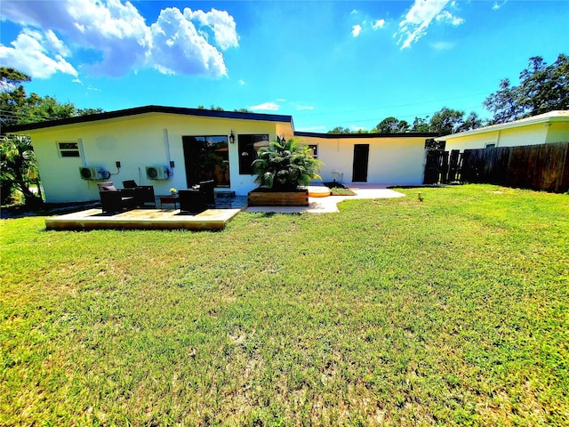 1373 Fairfax Rd, Clearwater, FL 33764 - back of house featuring stucco siding and a patio area