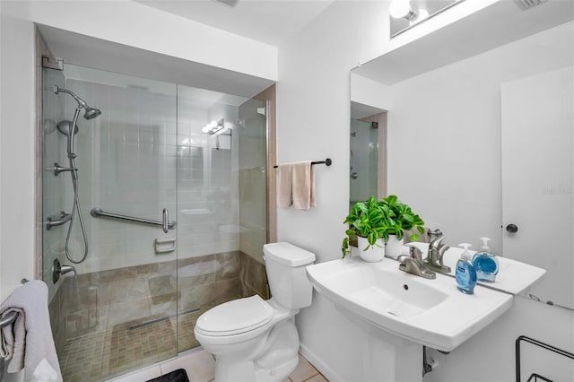 1400 Tarpon Woods Blvd Unit A4, Palm Harbor, FL 34685 - bathroom featuring toilet, a stall shower, and tile patterned floors