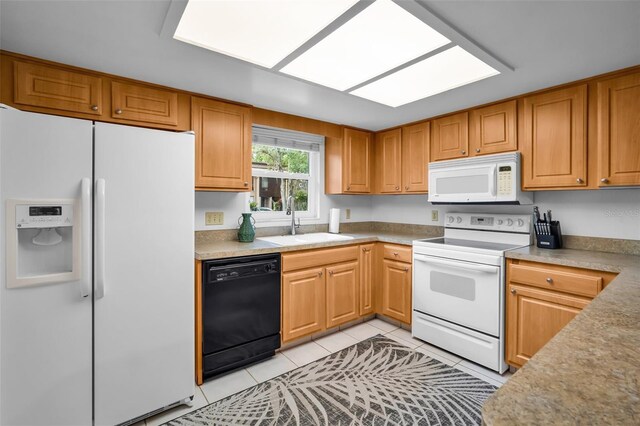 1400 Tarpon Woods Blvd Unit A4, Palm Harbor, FL 34685 - kitchen with white appliances, a sink, and light tile patterned flooring