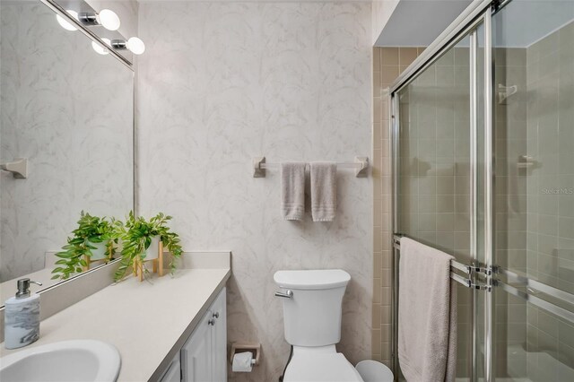 1400 Tarpon Woods Blvd Unit A4, Palm Harbor, FL 34685 - full bath with vanity, toilet, a shower stall, and wallpapered walls