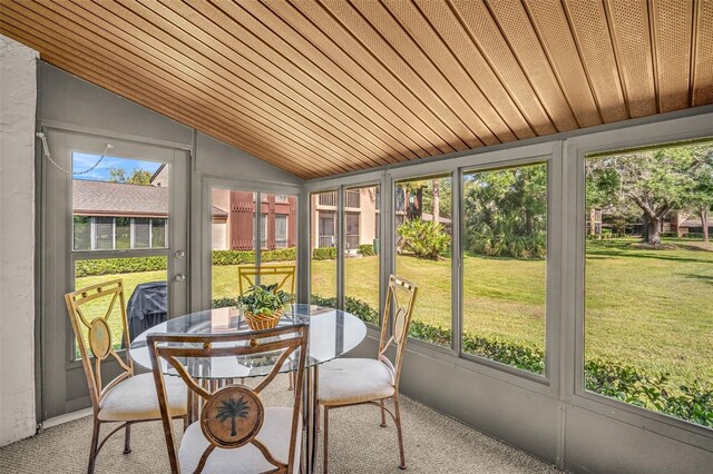 1400 Tarpon Woods Blvd Unit A4, Palm Harbor, FL 34685 - sunroom / solarium featuring vaulted ceiling and outdoor dining space