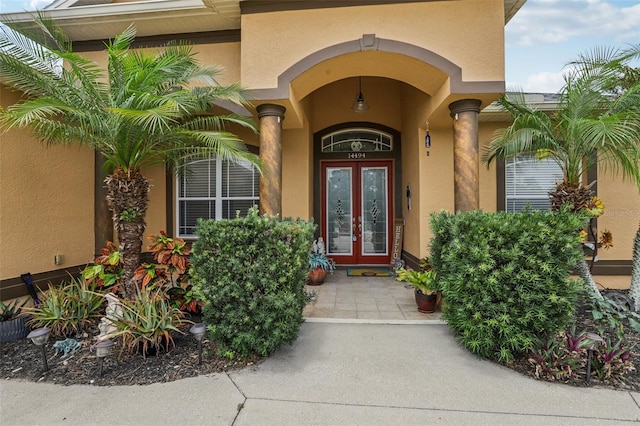 14494 Copeland Way, Brooksville, FL 34604 - doorway to property featuring french doors and stucco siding