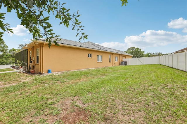 14494 Copeland Way, Brooksville, FL 34604 - view of home's exterior with stucco siding and central AC