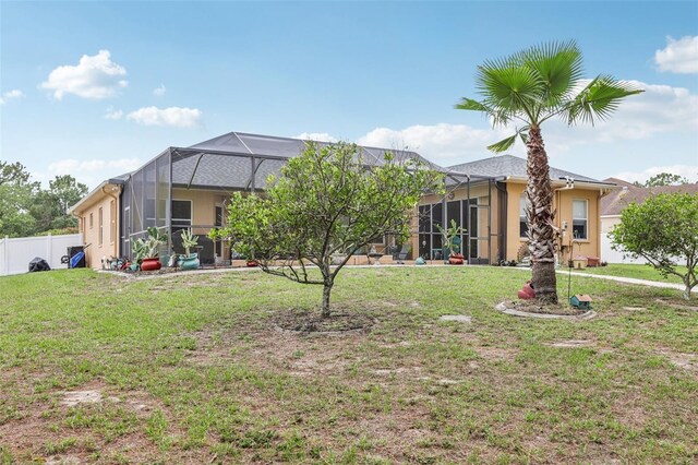14494 Copeland Way, Brooksville, FL 34604 - back of property featuring stucco siding and glass enclosure