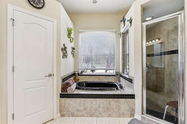 14494 Copeland Way, Brooksville, FL 34604 - bathroom with a garden tub, tile patterned flooring, and a stall shower